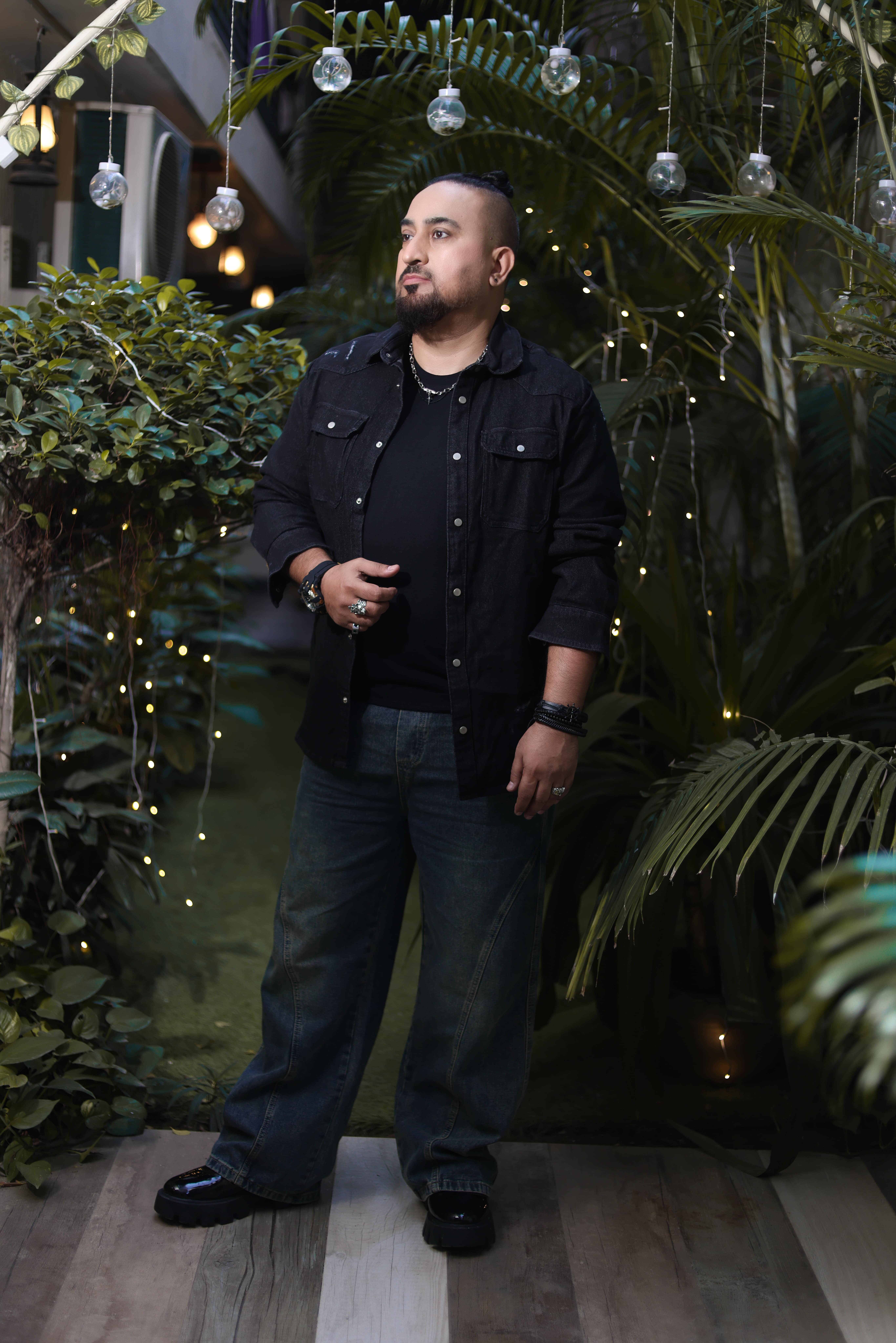 Classic Black Denim Overshirt with Button Closure and Utility Pockets Paired with Relaxed-Fit Blue Jeans - Image 2